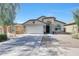 Charming single-story home featuring a two-car garage, arched entry, and desert landscaping for low maintenance at 2716 W Sunland Ave, Phoenix, AZ 85041