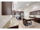 Inviting kitchen showcases granite countertops, stainless appliances, and a convenient center island at 2716 W Sunland Ave, Phoenix, AZ 85041