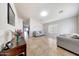 Bright living room with tile floors, neutral paint, and comfortable seating, creating a welcoming atmosphere at 2716 W Sunland Ave, Phoenix, AZ 85041