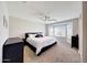 Serene main bedroom with neutral tones, a ceiling fan, and a large window offering picturesque views at 2716 W Sunland Ave, Phoenix, AZ 85041