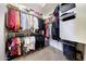 Spacious walk-in closet with ample hanging space and shelving for organized storage at 2716 W Sunland Ave, Phoenix, AZ 85041