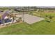 Aerial view of a community sand volleyball court adjacent to covered picnic tables at 2948 E Mecklenburg Way, San Tan Valley, AZ 85143