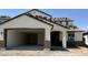 Charming single-Gathering home featuring a two-car garage and stucco exterior; roof is being installed at 2968 E Mecklenburg Way, San Tan Valley, AZ 85143