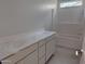 Clean bathroom featuring white vanity, tub, and shower with modern fixtures and ample storage at 2988 E Mecklenburg Way, San Tan Valley, AZ 85143
