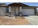 Charming single-story home featuring a two-car garage and an inviting front entrance at 2988 E Mecklenburg Way, San Tan Valley, AZ 85143