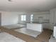 Spacious living room and kitchen area with tile flooring, bright light, and open floor plan at 2988 E Mecklenburg Way, San Tan Valley, AZ 85143