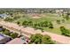 Aerial view of a home with a pool, near community baseball fields and recreation areas at 3214 N 138Th Dr, Avondale, AZ 85392