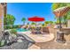 Outdoor kitchen, pool with a slide, and dining area, all in the backyard at 3214 N 138Th Dr, Avondale, AZ 85392