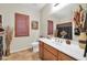Well-lit bathroom with a vanity, decorative mirror, and modern fixtures at 3214 N 138Th Dr, Avondale, AZ 85392