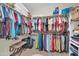 Walk-in closet providing ample storage space for clothing, accessories, and personal items at 3214 N 138Th Dr, Avondale, AZ 85392