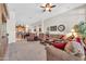 Open-concept living room with access to the kitchen and comfortable seating at 3214 N 138Th Dr, Avondale, AZ 85392