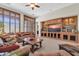 Comfortable living room with custom built-ins and ample seating at 3214 N 138Th Dr, Avondale, AZ 85392