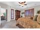 Elegant main bedroom with a private balcony and wood furniture at 3214 N 138Th Dr, Avondale, AZ 85392