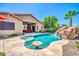 Backyard with a pool, a rock waterfall and slide, plus a swim-up bar at 3214 N 138Th Dr, Avondale, AZ 85392