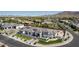 Picturesque aerial shot highlighting a modern home nestled in a vibrant community with stunning mountain vistas at 3653 E Runaway Bay Pl, Queen Creek, AZ 85142