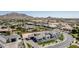 Expansive aerial view of custom home and neighborhood with mountain views and meticulously landscaped yards at 3653 E Runaway Bay Pl, Queen Creek, AZ 85142