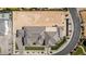 Expansive aerial view showcases a sprawling estate, a sports court, and a large, undeveloped lot with potential at 3653 E Runaway Bay Pl, Queen Creek, AZ 85142