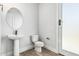 Elegant bathroom with a pedestal sink, modern fixtures, and sleek design at 3653 E Runaway Bay Pl, Queen Creek, AZ 85142