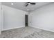 Large empty carpeted bedroom with access to other rooms at 3653 E Runaway Bay Pl, Queen Creek, AZ 85142