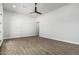 Large room features wood floors, recessed lighting and a modern ceiling fan at 3653 E Runaway Bay Pl, Queen Creek, AZ 85142