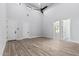 Spacious bedroom features high ceilings, wood-look flooring, and access to other rooms at 3653 E Runaway Bay Pl, Queen Creek, AZ 85142