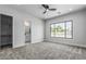 Bedroom boasts carpet floors and a view into the backyard at 3653 E Runaway Bay Pl, Queen Creek, AZ 85142