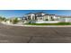 Elegant modern home with synthetic turf landscaping, decorative rocks, and a clean fence in a well-maintained neighborhood at 3653 E Runaway Bay Pl, Queen Creek, AZ 85142