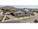 Luxurious home featuring a manicured lawn, paved driveway, and a sleek, modern design at 3653 E Runaway Bay Pl, Queen Creek, AZ 85142