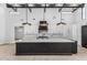Bright kitchen with marble countertops, island, custom cabinetry, and modern stainless appliances at 3653 E Runaway Bay Pl, Queen Creek, AZ 85142