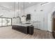 Bright kitchen with marble countertops, island, custom cabinetry, and modern stainless appliances at 3653 E Runaway Bay Pl, Queen Creek, AZ 85142