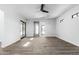 Spacious living room with wood floors, bright lighting, and high ceilings at 3653 E Runaway Bay Pl, Queen Creek, AZ 85142