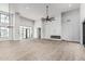 Spacious living room featuring high ceilings, lots of natural light, and a modern fireplace at 3653 E Runaway Bay Pl, Queen Creek, AZ 85142