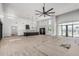 Open concept living room and kitchen area with lots of natural light and luxury finishes at 3653 E Runaway Bay Pl, Queen Creek, AZ 85142
