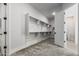 Carpeted walk-in closet with ample shelving and doorway to the Primary bathroom at 3653 E Runaway Bay Pl, Queen Creek, AZ 85142