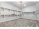 Spacious walk-in closet with custom shelving and contemporary lighting at 3653 E Runaway Bay Pl, Queen Creek, AZ 85142