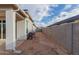 Enclosed backyard with privacy wall, covered patio and outdoor grill, perfect for relaxation and entertaining at 37790 W Santa Clara Ave, Maricopa, AZ 85138