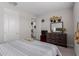 This cozy bedroom offers carpeted floors and a large dresser at 37790 W Santa Clara Ave, Maricopa, AZ 85138