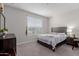 Cozy bedroom features a neutral color scheme, plush carpeting, and lots of light at 37790 W Santa Clara Ave, Maricopa, AZ 85138