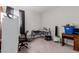 Functional bedroom with a desk, a chair, and lots of space for organization at 37790 W Santa Clara Ave, Maricopa, AZ 85138