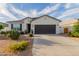 Charming single-story home with a two-car garage and low-maintenance desert landscaping at 37790 W Santa Clara Ave, Maricopa, AZ 85138