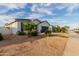 Charming home with a two-car garage, gravel landscaping, and a view of neighboring homes at 37790 W Santa Clara Ave, Maricopa, AZ 85138