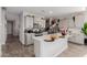 Beautiful kitchen features an island, stylish cabinets, and modern appliances at 37790 W Santa Clara Ave, Maricopa, AZ 85138