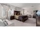 Elegant main bedroom features a dark wood bed frame and neutral-toned walls at 37790 W Santa Clara Ave, Maricopa, AZ 85138