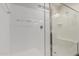 Modern glass enclosed shower provides a clean and bright spa experience at 37790 W Santa Clara Ave, Maricopa, AZ 85138