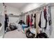 This walk-in closet features shelving and hanging storage at 37790 W Santa Clara Ave, Maricopa, AZ 85138