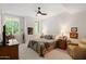 Cozy bedroom with ceiling fan, plantation shutters, and neutral decor at 3801 N Goldwater Blvd # 201, Scottsdale, AZ 85251