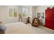 Bright bedroom with shuttered windows, cozy chair, and light-toned walls exudes comfort at 3801 N Goldwater Blvd # 201, Scottsdale, AZ 85251