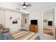 Bedroom features a comfy chair, dresser, and an ensuite bathroom at 3801 N Goldwater Blvd # 201, Scottsdale, AZ 85251