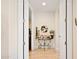 Inviting entryway featuring a decorative table, a mirror, and neutral walls at 3801 N Goldwater Blvd # 201, Scottsdale, AZ 85251