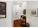 Bright hallway with a front door, hardwood floors, and decorative artwork creates a welcoming entrance at 3801 N Goldwater Blvd # 201, Scottsdale, AZ 85251